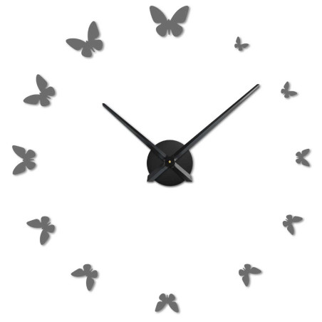 Kreatívne spracovanie hodín, kde sú časové body nahradené dekoratívnymi motýľmi pre vizuálny efekt. Kreatívne spracovanie hodín, kde sú časové body nahradené dekoratívnymi motýľmi pre vizuálny efekt.