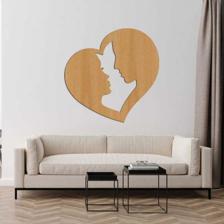 Profil muža a ženy jemne vyrezaný do srdcového rámu ako symbol spojenia. Profil muža a ženy jemne vyrezaný do srdcového rámu ako symbol spojenia.